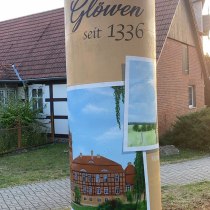Gestaltung einer Litfaßsäule in einer schönen Gemeinde mit historischen Bildern aus dem Archiv.